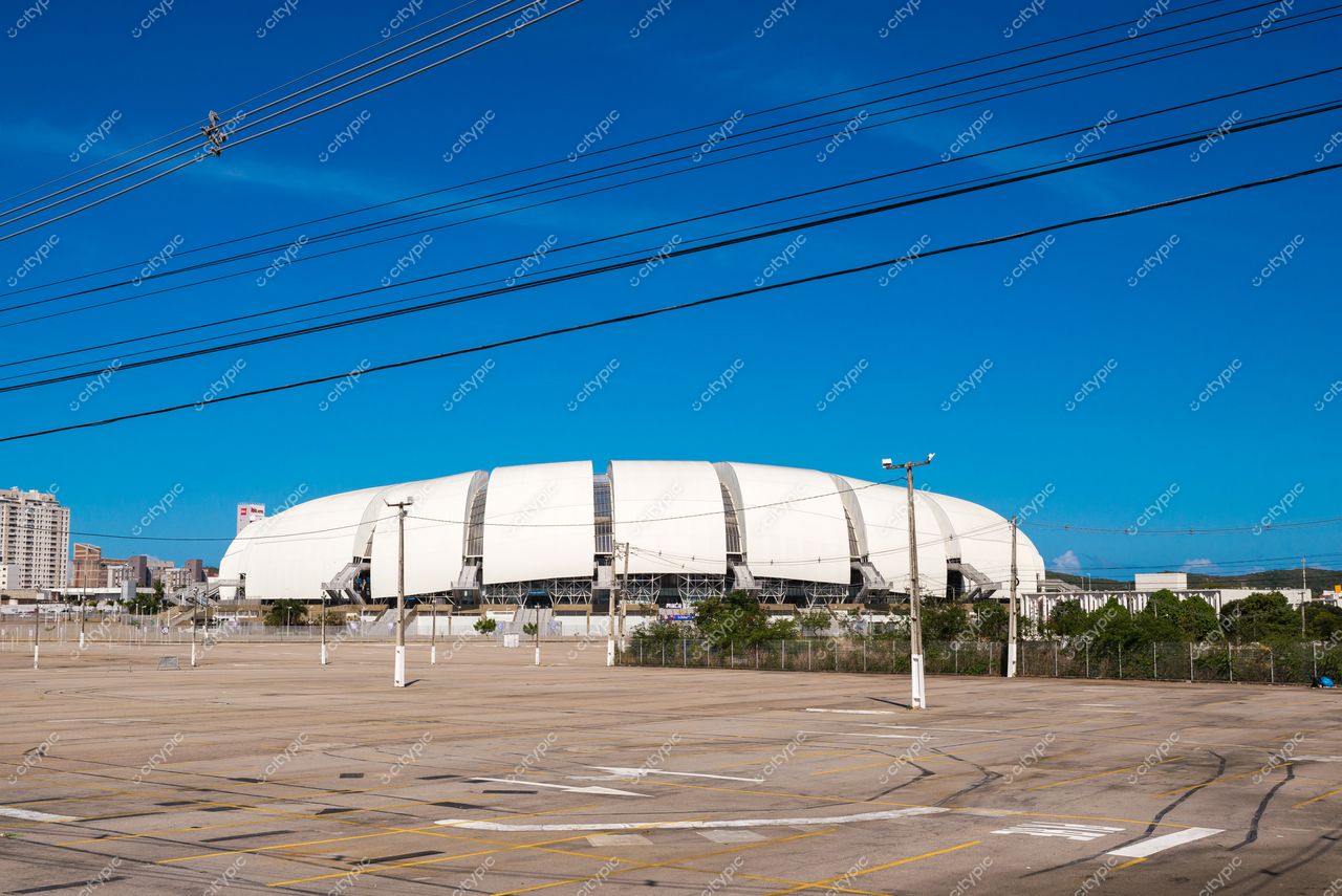 Natal, Rio Grande do Norte, Arena das Dunas com estacionamento vazio e céu azul em dia ensolarado